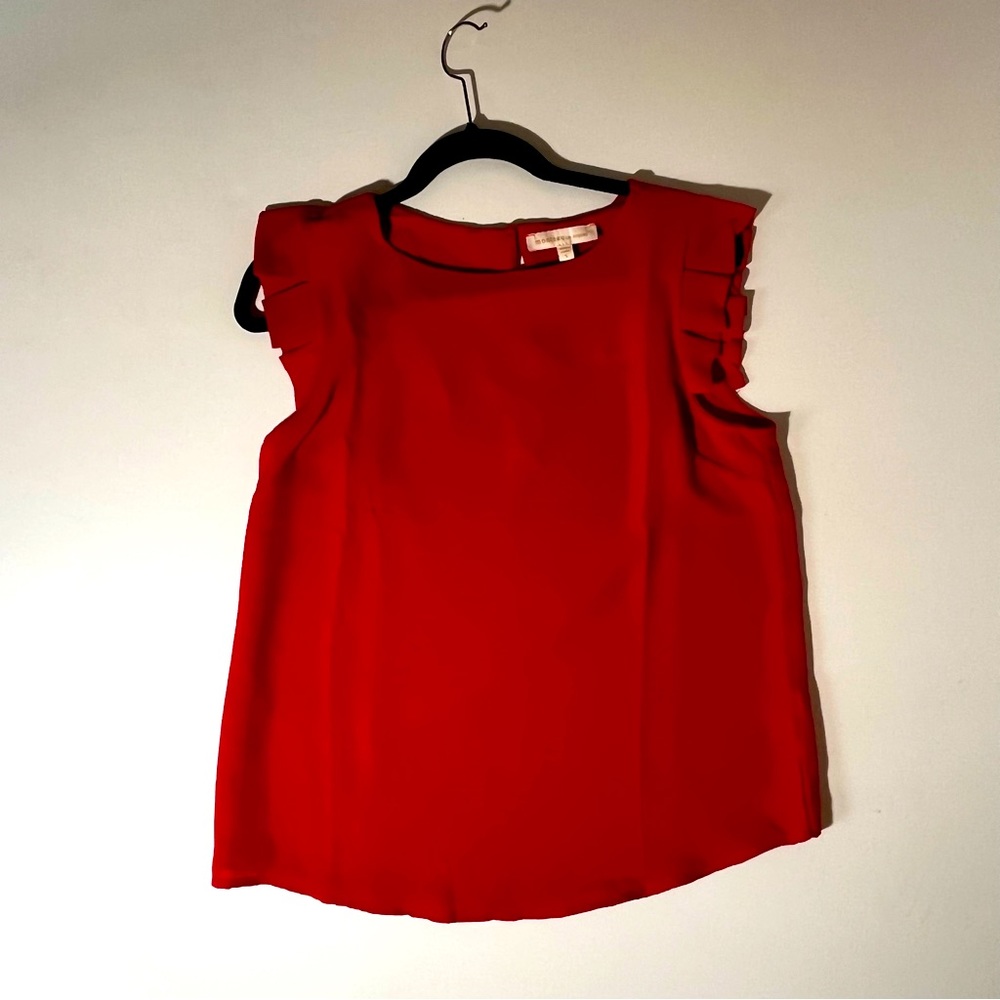 Red , shorts, short sleeve with flutter detail.